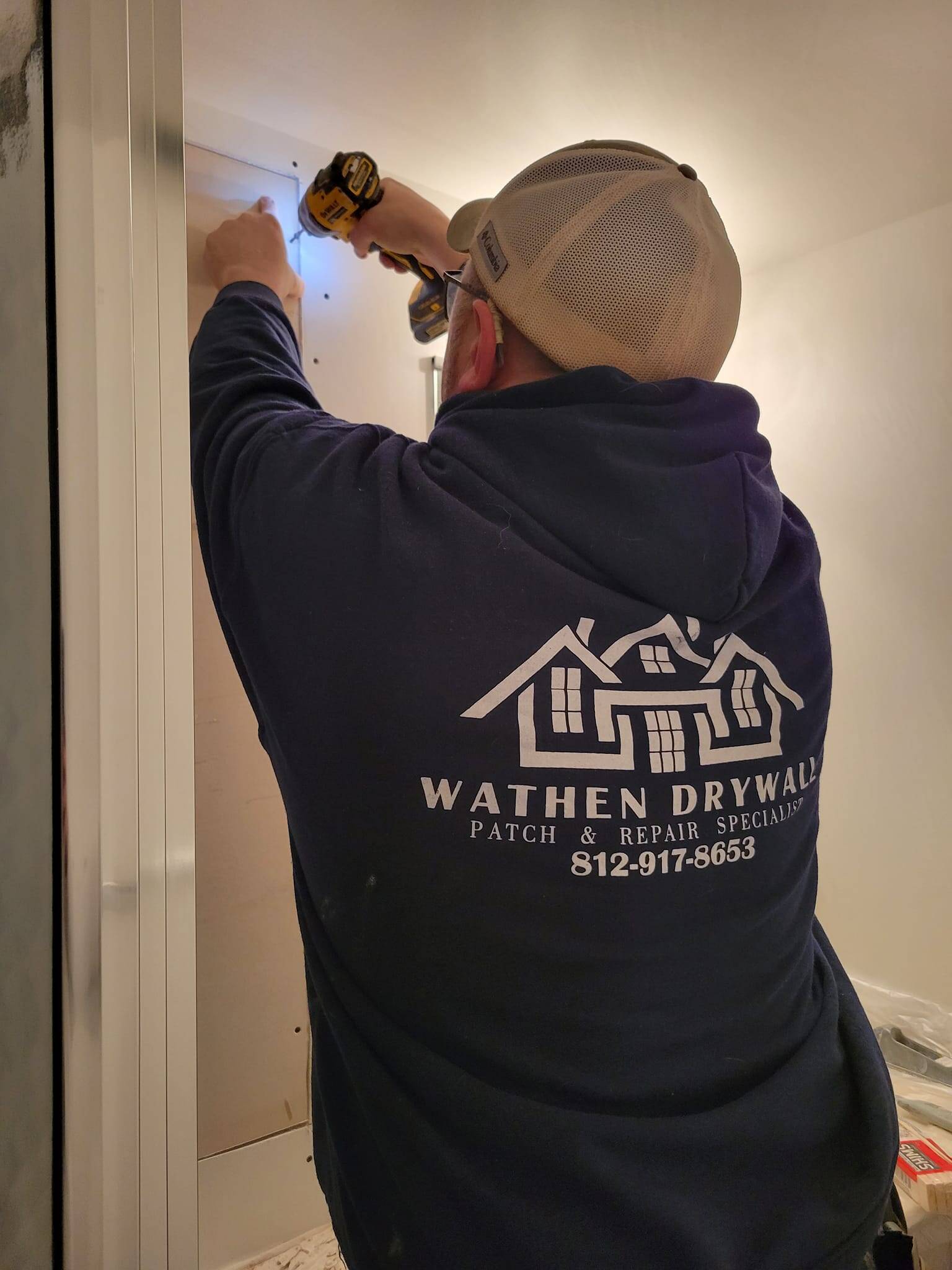 Mikey Wathen, owner of Wathen Drywall, on the job in Cincinnati OH
