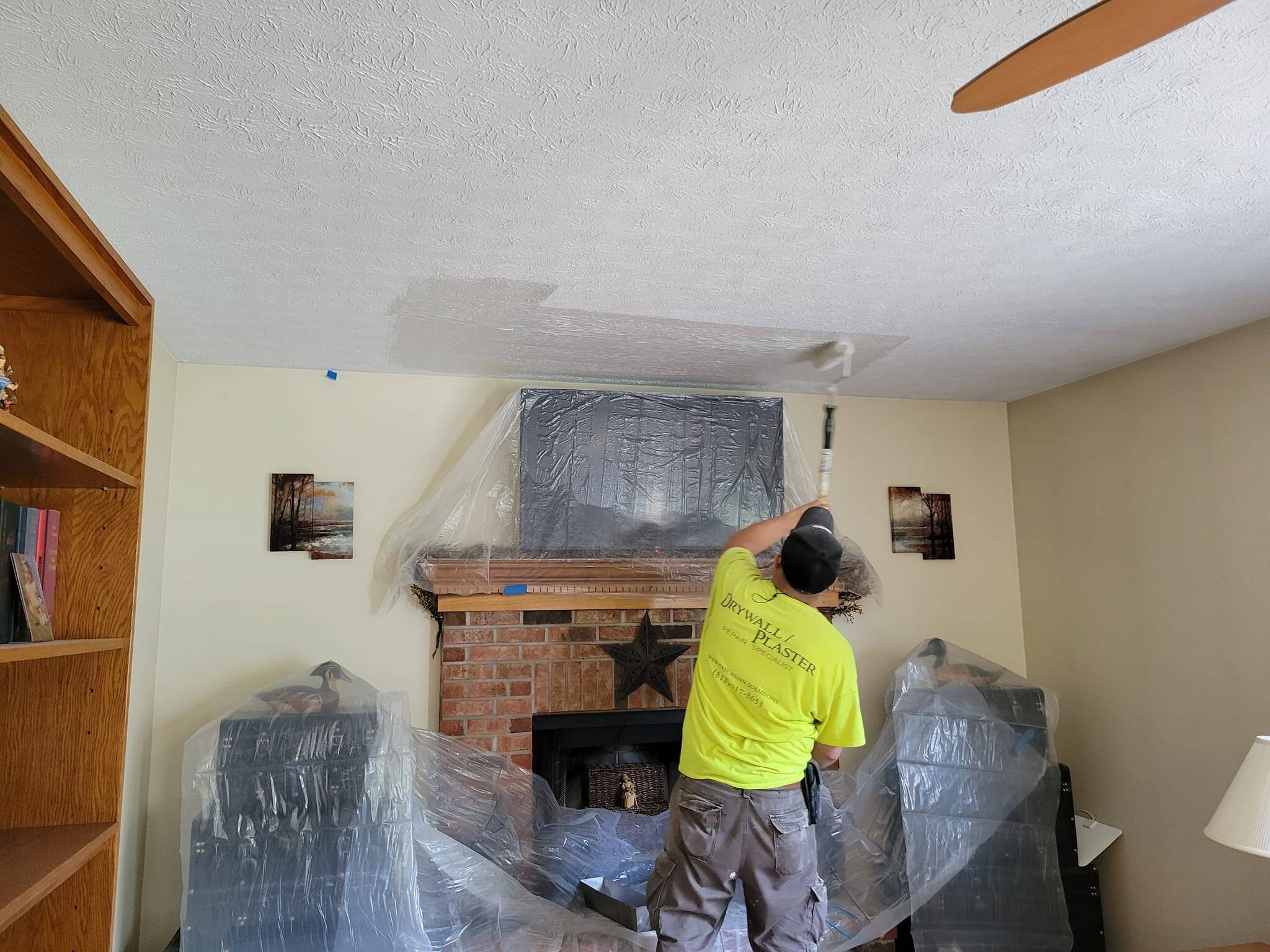 Ceiling patch and texture match above brick fireplace
